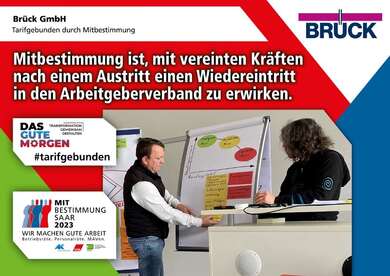 Plakat zur Mitbestimmungsmesse mit dem Slogan "Mitbestimmung ist, mit vereinten Kräften nach einem Austritt einen Wiedereintritt in den Arbeitgeberverband zu erwirken"