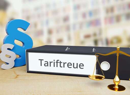 Ordner mit Schriftzug "Tariftreue", Paragrafen-Symbole