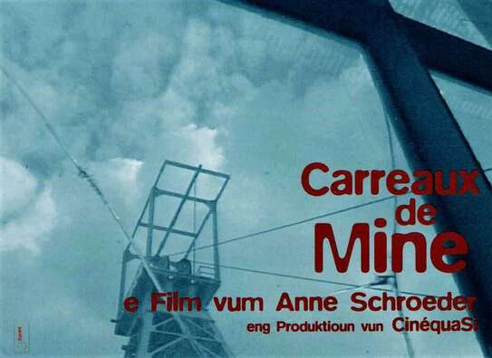 Förderturm. Schriftzug "Carreaux de Mine - ein Film von Anne Schröder"