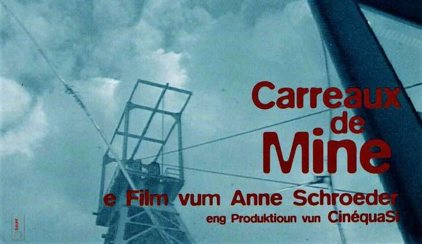 Förderturm. Schriftzug "Carreaux de Mine - ein Film von Anne Schröder"